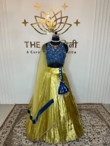 Yellow velvet lehenga and blue stone blouse