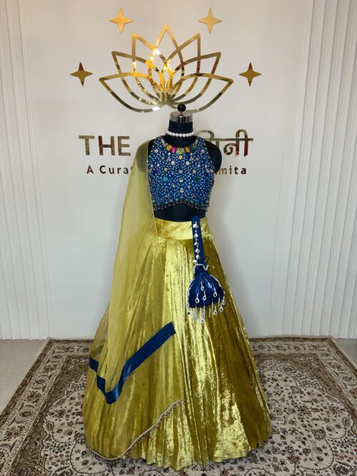 Yellow velvet lehenga and blue stone blouse