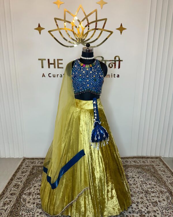 Yellow velvet lehenga and blue stone blouse