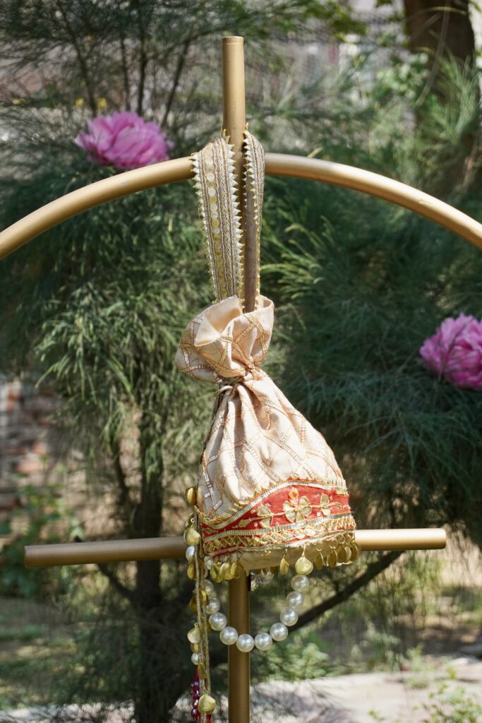 Swamini Royal Zari Pearl Bridal Potli Bag - Image 3