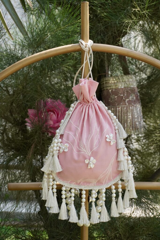 Swamini Blush Pearl Tassel Potli Bag - Image 3