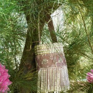 Elegant dusty pink and rose gold bucket-style bag featuring intricate floral sequin embroidery, a gold sequined top border, and dramatic shimmering fringe tassels hanging from the base.