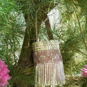 Elegant dusty pink and rose gold bucket-style bag featuring intricate floral sequin embroidery, a gold sequined top border, and dramatic shimmering fringe tassels hanging from the base.