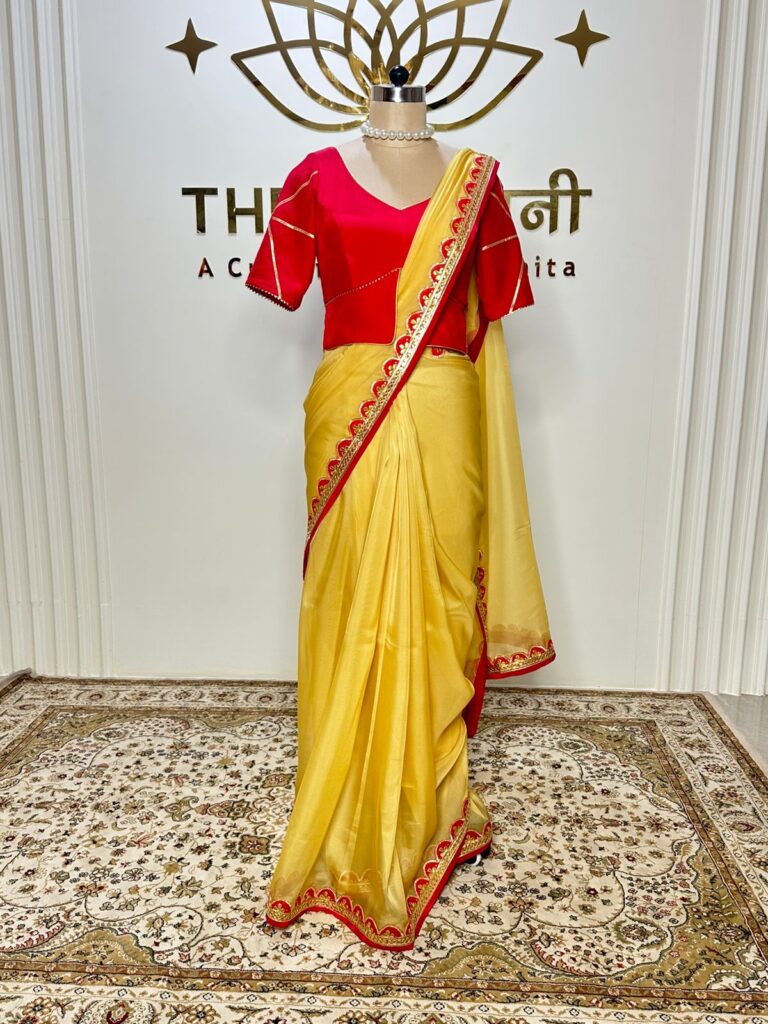 Yellow Organza Saree with Red Crepe Blouse