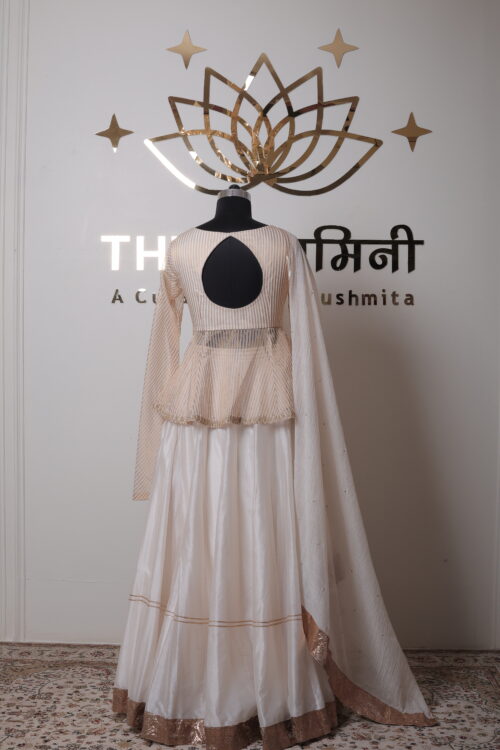 Lightweight Mal Chanderi dupatta with delicate borders draped over the shoulder.