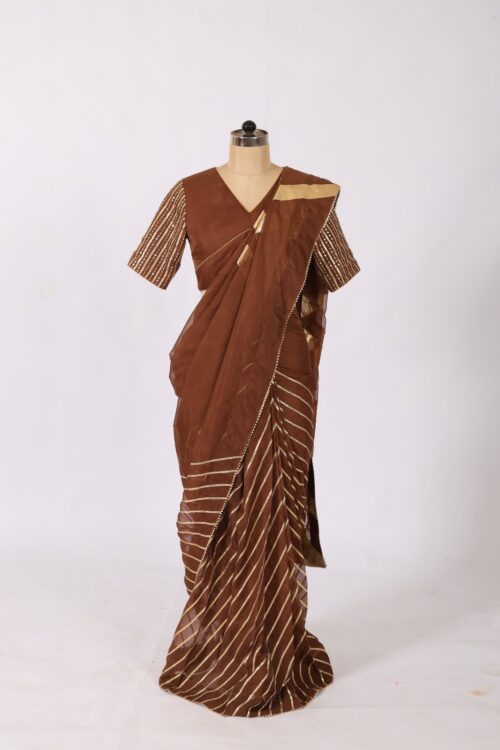 Dark brown organza saree with heavy gold gotta work stripes and sequin blouse front view by The Swamini