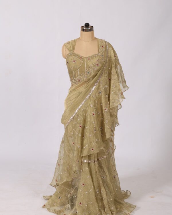 Theswamini green truffle silk saree featuring full embroidery and a designer concert blouse for women's ethnic wear.